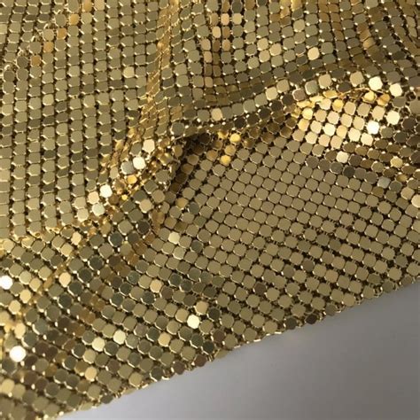 metallic gold net fabric|white fabric with gold accents.